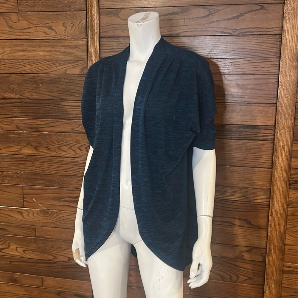 Magazine size small short sleeve cardigan. Dark green